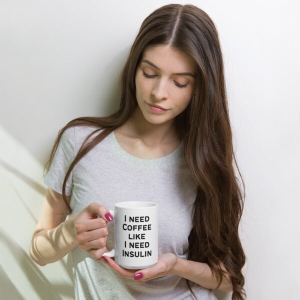 Model holding coffee mug that says "I need coffee like I need Insulin"